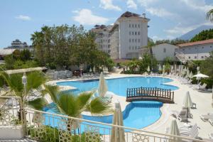 a view of a swimming pool in a resort at MIRAMOR HOTEL & Spa - ULTRA ALL INCLUSIVE in Antalya
