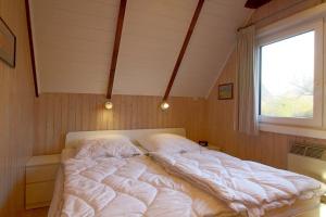 Postel nebo postele na pokoji v ubytování SE RP8 Ferienhaus am Wattenmeer "3 DTV Sterne"