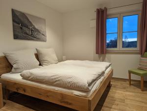 Postel nebo postele na pokoji v ubytování ApartSchön