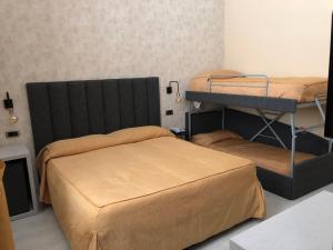 Postel nebo postele na pokoji v ubytování Hotel Tirrenia