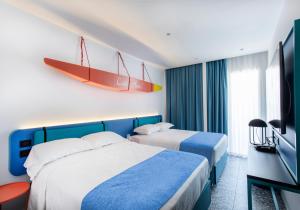 Postel nebo postele na pokoji v ubytování Hotel Albatros