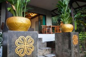 two large vases sitting on top of some stairs at Deep Dream Chalet in Hinkong