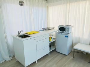 Η κουζίνα ή μικρή κουζίνα στο Ático Cádiz 360