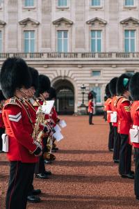a group of marching bands in front of a building at The Tophams Hotel in London