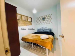 a bedroom with a bed with a sign on the wall at OCEAN ESCAPE@Selesa Hillhomes, Bukit Tinggi Pahang in Bentong +15 photos