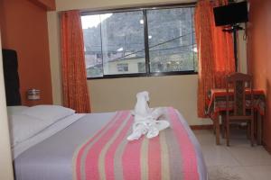 Postel nebo postele na pokoji v ubytování hostal Qorisonqo inn ollantaytambo