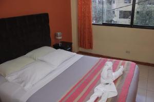 Postel nebo postele na pokoji v ubytování hostal Qorisonqo inn ollantaytambo