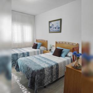 Voodi või voodid majutusasutuse Hostal La Llave toas