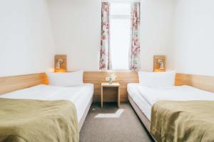 Voodi või voodid majutusasutuse Hotel Andres toas