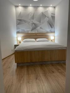 Postel nebo postele na pokoji v ubytování Apartamenty Grodowa 2