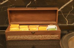 a wooden box filled with books sitting next to a sink at Planinska kuća "Soko' Romanija" in Pale