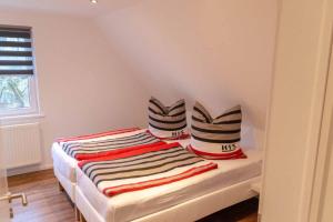 En eller flere senge i et værelse på Ferienwohnung Hofmann-Trier