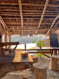 a picnic table with a view of the ocean at Happy Lemon Tree lodge in Sauraha