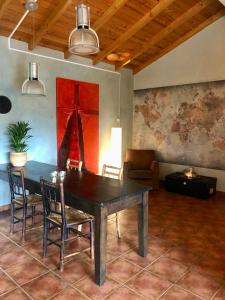 a dining room with a table and chairs at Lovely quinta in nature with pool - Tomar in Pero Calvo