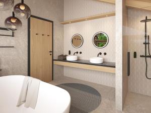 Cosy, new chalet with garden and private sauna في بيشلباخ: حمام مع مغسلتين وحوض استحمام