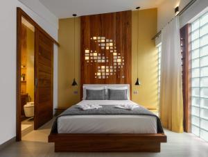 Een bed of bedden in een kamer bij Villa Nautica Boutique Hotel