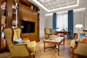 a living room with a couch and a table at Luxury Apartments by Palazzo Portinari Salviati in Florence