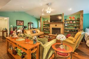 a living room filled with furniture and a fireplace at Carrabelle Home Near River, Beach and Downtown! in Carrabelle