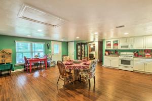 a kitchen and dining room with a table and chairs at Carrabelle Home Near River, Beach and Downtown! in Carrabelle