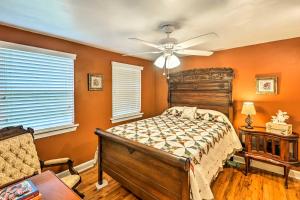 a bedroom with a bed and a ceiling fan at Carrabelle Home Near River, Beach and Downtown! in Carrabelle