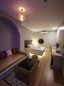 Postel nebo postele na pokoji v ubytování Chul Boutique Villa จุล บูทิค วิลล่า + 6 fotografií
