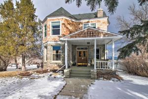 a brick house with a front door in the snow at Historic Helena Home with Mtn Views - 2 Mi to Dtwn! in Helena