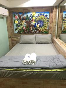 Postel nebo postele na pokoji v ubytování Bankhunchang Ramkhamhaeng hotel