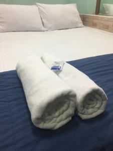Postel nebo postele na pokoji v ubytování Bankhunchang Ramkhamhaeng hotel