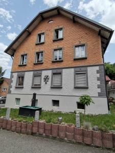 a large house with windows on the side of it at Franzl Hof Zorell in Ravensburg