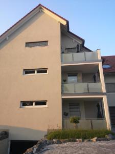 an apartment building with balconies on the side at Franzl Hof Zorell in Ravensburg