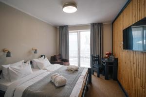 Postel nebo postele na pokoji v ubytování RUBEL APARTHOTEL&SPA