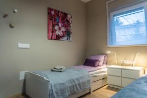 Postel nebo postele na pokoji v ubytování Babvirág Porta Fonyódliget