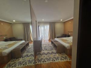 Letto o letti in una camera di Hotel Mountain Mestia
