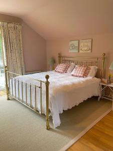 a bedroom with a bed with two pillows on it at Meadow View in Mayfield