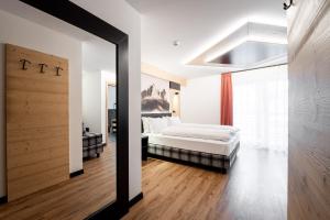 Postel nebo postele na pokoji v ubytování Albergo Garni Edy (B&B)