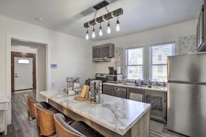 a kitchen with a large counter with a refrigerator at Pet-Friendly Home Rental Near Notre Dame! in South Bend