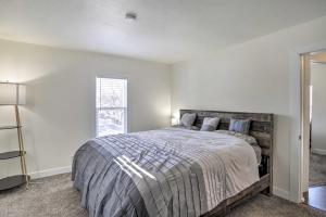 a bedroom with a bed and a window at Pet-Friendly Home Rental Near Notre Dame! in South Bend