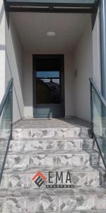 a entrance to a building with a glass door at Apartman Ema in Valjevo