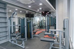 a gym with lots of equipment in a building at Studio Apartments and Ensuite Bedrooms with Shared Kitchen at Chapter Ealing right next to North Acton Tube Station in London