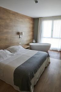 Postel nebo postele na pokoji v ubytování Hotel L'Algadir del Delta