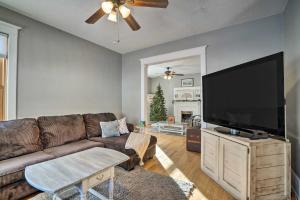 a living room with a couch and a flat screen tv at Saint Paul Home in Historic Cathedral Hill in Saint Paul