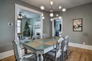 a dining room with a table and a christmas tree at Saint Paul Home in Historic Cathedral Hill in Saint Paul