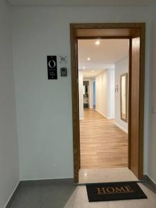 an open door to a hallway with a hall way at Deluxe Bay View in Câmara de Lobos