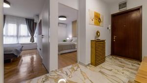 Posteľ alebo postele v izbe v ubytovaní President Apartment with Sauna