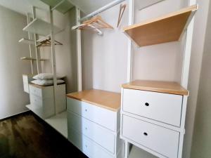 a closet with white drawers and white cabinets at Hiera' in Lecce +15 photos
