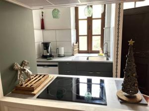 Kuchyňa alebo kuchynka v ubytovaní labarretaine , une maison de caractère