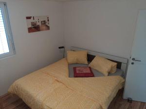 A bed or beds in a room at Wohnung Rheintal im Alpenvorland