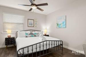 a bedroom with a bed with a ceiling fan at Walk To Zilker King Bed Pool Free Parking in Austin