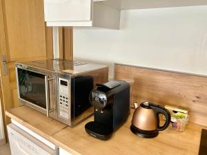 Kuchyňa alebo kuchynka v ubytovaní Appartement Léonard, comme à la maison - Vieux Lille
