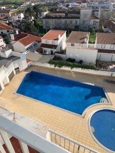 an overhead view of a swimming pool on top of a building at Apartment 505 in São Martinho do Porto
